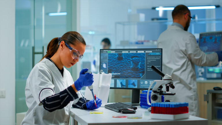 scientist-modern-equipped-medical-laboratory-examinining-drug-discovery-with-micropipette-medical-stuff-examining-vaccine-evolution-using-high-tech-technology-researching-treatment-development